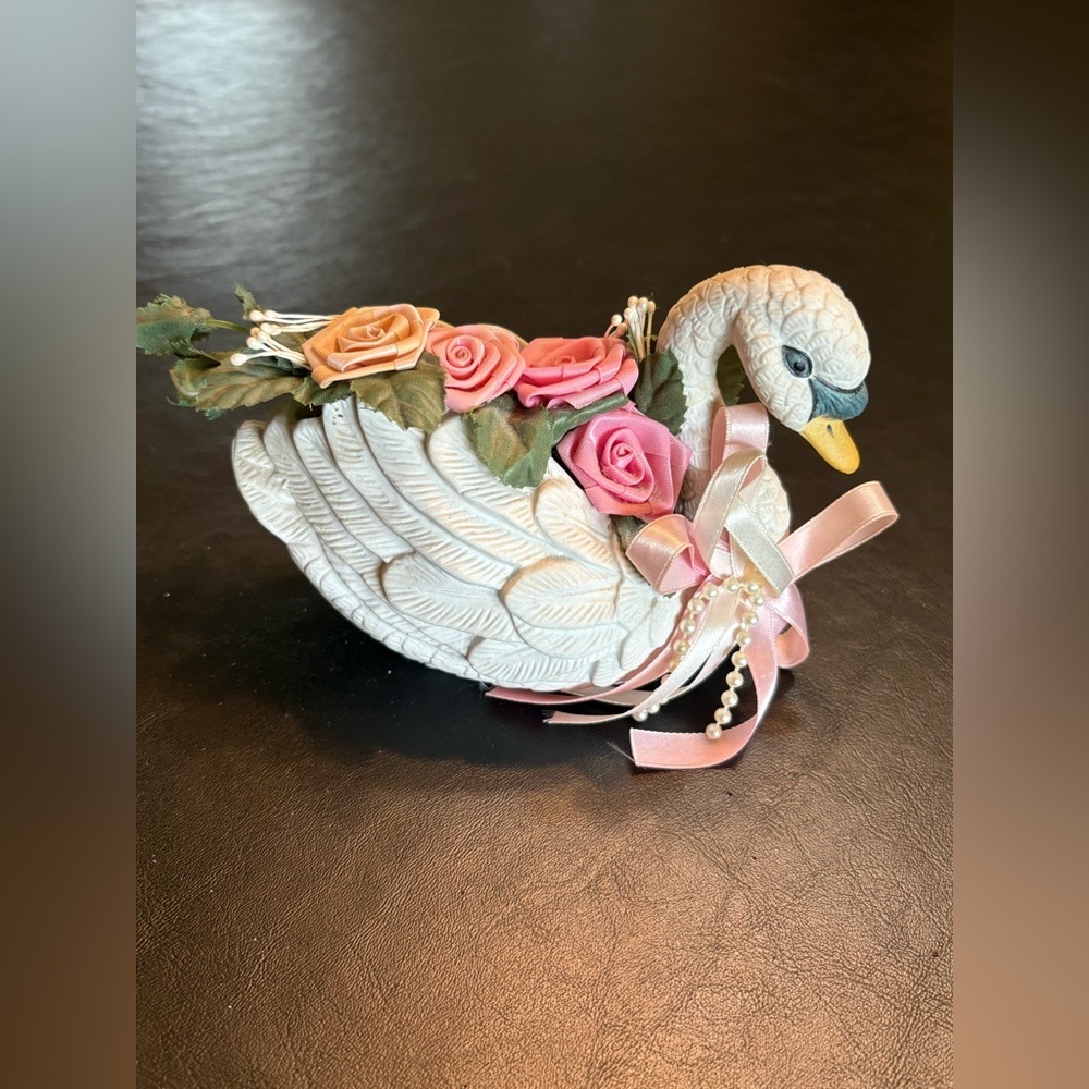 Vintage Porcelain Swan with silk Flowers.
